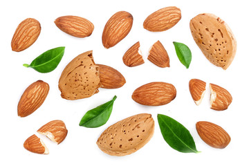 almonds with leaves isolated on white background. Top view. Flat lay pattern
