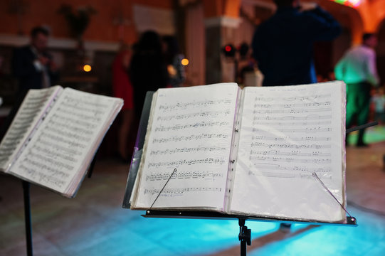 Close-up photo of a music stand in the restaurant on the wedding party.