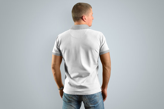 Athletic man in the white polo shirt, back view. Mockup for your design.