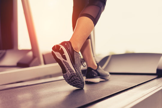 Exercise Treadmill Cardio Running Workout At Fitness Gym Of Woman Taking Weight Loss With Machine Aerobic For Slim And Firm Healthy In The Morning.