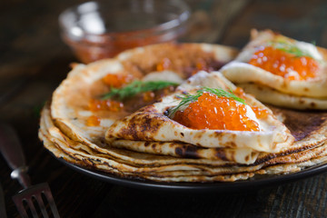 Russian pancakes with red caviar