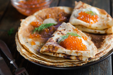 Russian pancakes with red caviar