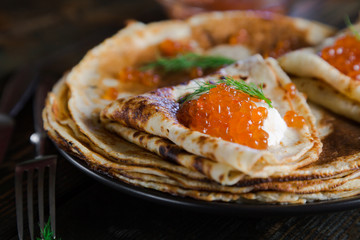 Russian pancakes with red caviar