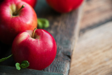 group of red apples on wooden natural background, fresh natural food and vitamins concept in rustic style