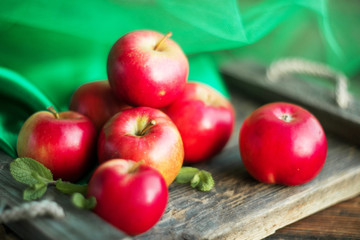 group of red apples on wooden natural background, fresh natural food and vitamins concept in rustic style
