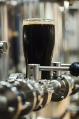 Pint of stout in a brewery