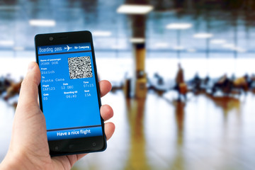 Electronic boarding pass on the screen of smartphone. Concept of modern travel.