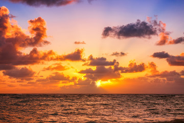 Naklejka na ściany i meble Beautiful sunrise over the sea