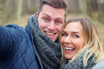 Fototapeta premium selfie of young couple outdoors in the cold