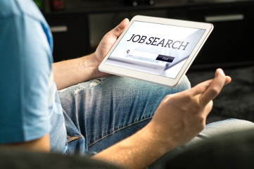 Happy job seeker trying to find work using online search engine home with tablet, Unemployment...