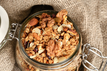 Granola from several types of cereals with nuts,coconut chips and dried cranberry.