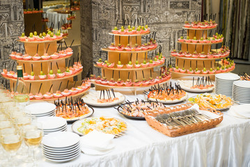 Grapes, olives, cheese, canapés, buffet, food.