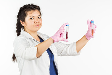 Female doctor with a stethoscope holding a medical bottle, on a white background.