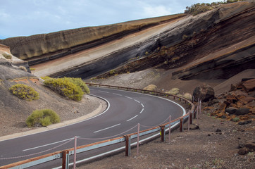 Mirador la Tarta (The Cake) in Teide National Park, shows layers of multi-coloured volcanic ashes,...