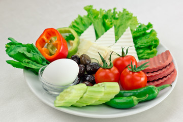Fresh beautiful vegetables on a plate. Breakfast with vegetables and egg.