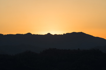 mountain ridge cut with orange twilight, Mae Sot, Thailand