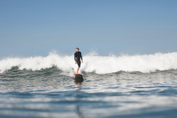 Fototapeta premium active man surfing wave in ocean