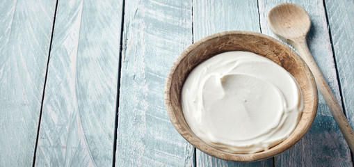 Rustic bowl of healthy natural Greek yogurt