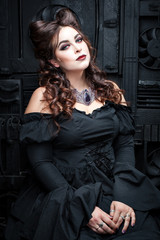 Young plump woman in a black dress.