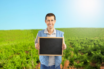 Farmer showing the blackboard