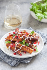 Crispy Halloumi cheese sticks Fries with yogurt sauce, pomegranate seeds and mint