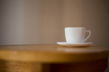 Coffee in a white cup on the table.