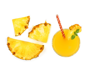 pineapple juice in a glass and pineapple slices isolated on white background with copy space for your text. Top view
