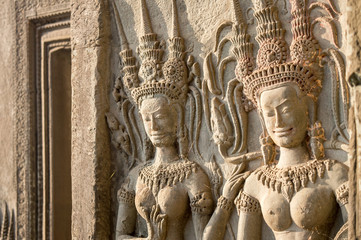 Fototapeta na wymiar Detail of women statues in Angkor Wat, Siem Rep, Cambodia