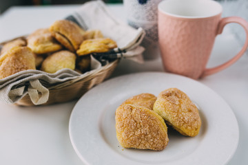 cookies with a pink mug on the table