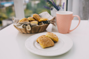 cookies with a pink mug on the table