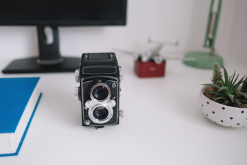 Vintage camera on cozy desk