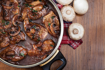 Delicious chicken marsala on frying pan