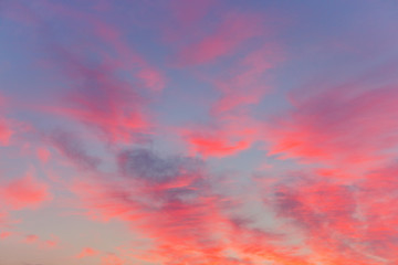 Pink purple sunset clouds on a blue sky. Colorfull abstract background