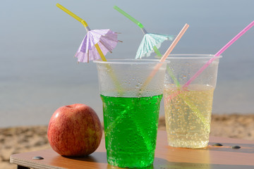 Two glasses of drink. Vacation on the sea.