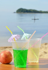 Two glasses of drink. Vacation on the sea.