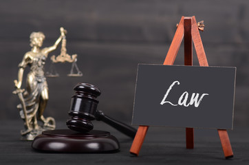 Blackboard, Judge Gavel, Lady Justice on the wooden background