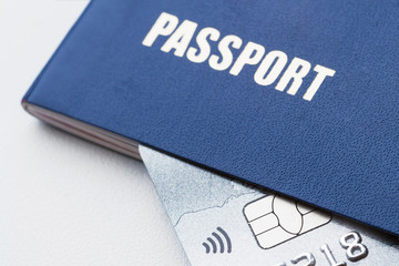 Blue passport with platinum credit card. Closeup, selective focus