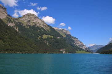 Naklejka na ściany i meble Turquoise lake Klontalersee in summer. Landscape in Glarus canton.