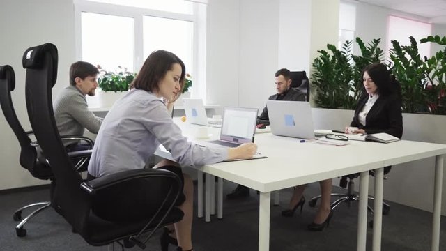 Business people working at a table in the office