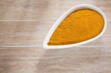 Organic turmeric powder in the bowl