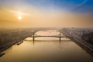 Fototapeta na wymiar Budapest, Hungary - Aerial panoramic skyline view of Liberty Bridge (Szabadsag Hid) over River Danube at sunrise with beautiful sky and clouds