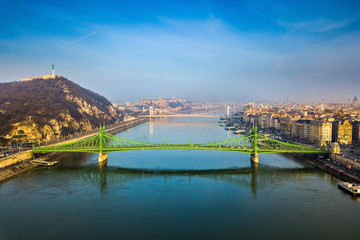 Obraz premium Budapest, Hungary - Aerial skyline view of beautiful Liberty Bridge on a sunny morning with Gellert Hill, Citadella, Statue of Liberty, Elisabeth Bridge and Buda Castle Royal Palace at background