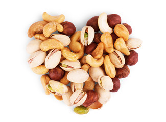 Assorted nuts and raisin closeup on white backgrounds.