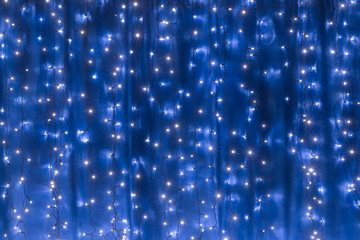 Blue led light curtain, closeup of festive background
