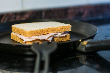 making a sandwich in a pan, in a frying pan with butter and sandwich bread, grilled in the pan