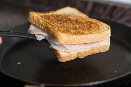 making a sandwich in a pan, in a frying pan with butter and sandwich bread, grilled in the pan