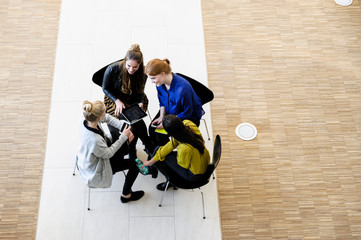 Colleagues having meeting using digital tablet