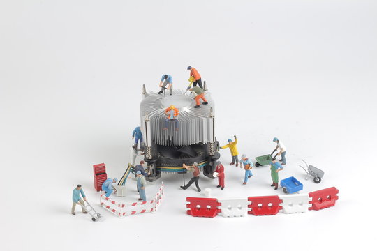 the Group of engineer workers are installing CPU