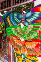 Souvenir shop with colorful kites in shapes of animals, insects and mythical creatures. Bali, Indonesia.