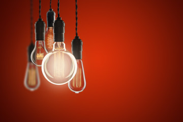 Vintage bulbs on color background - idea, innovation, teamwork and leadership concept. Space for text